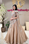 Luxury nude one-shoulder lehenga Pune. choker blouse pearl handwork at Urban Dulhaniya boutique MG Road.
Nude gold one-shoulder lehenga with choker blouse and shimmer organza skirt, Urban Dulhaniya Pune