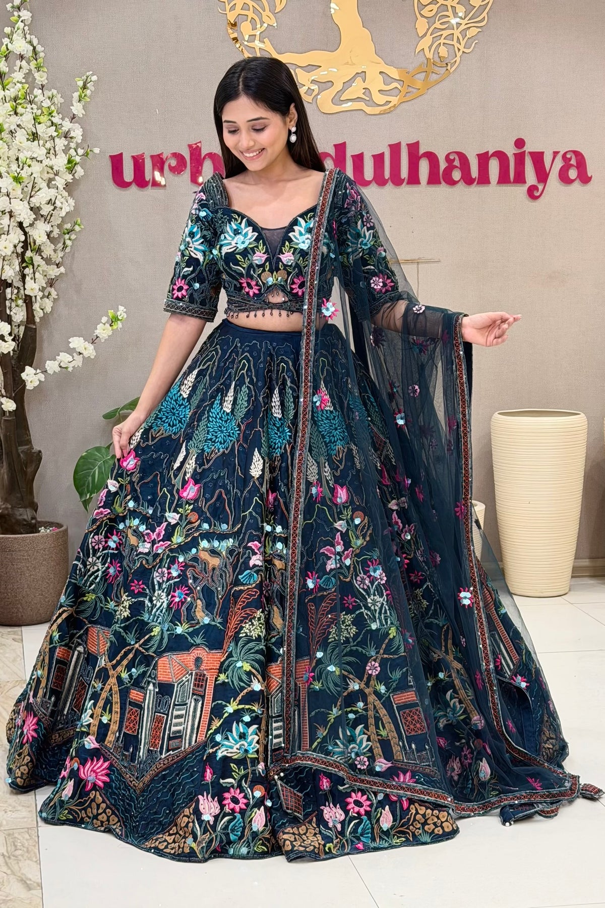 Navy blue lehenga blouse with multicolour Mughal garden embroidery and crystal tassels – Urban Dulhaniya Pune
Full length navy Mughal garden lehenga with multicolour thread skirt at Urban Dulhaniya MG Road Pune