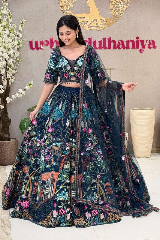Navy blue lehenga blouse with multicolour Mughal garden embroidery and crystal tassels – Urban Dulhaniya Pune
Full length navy Mughal garden lehenga with multicolour thread skirt at Urban Dulhaniya MG Road Pune