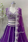 Close-up of heavy silver beads and sequin embroidery on royal purple designer choli blouse.