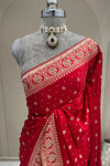 Upper front drape view red satin silk saree with moti zardoshi cutdana, premium ethnic wear from Urban Dulhaniya