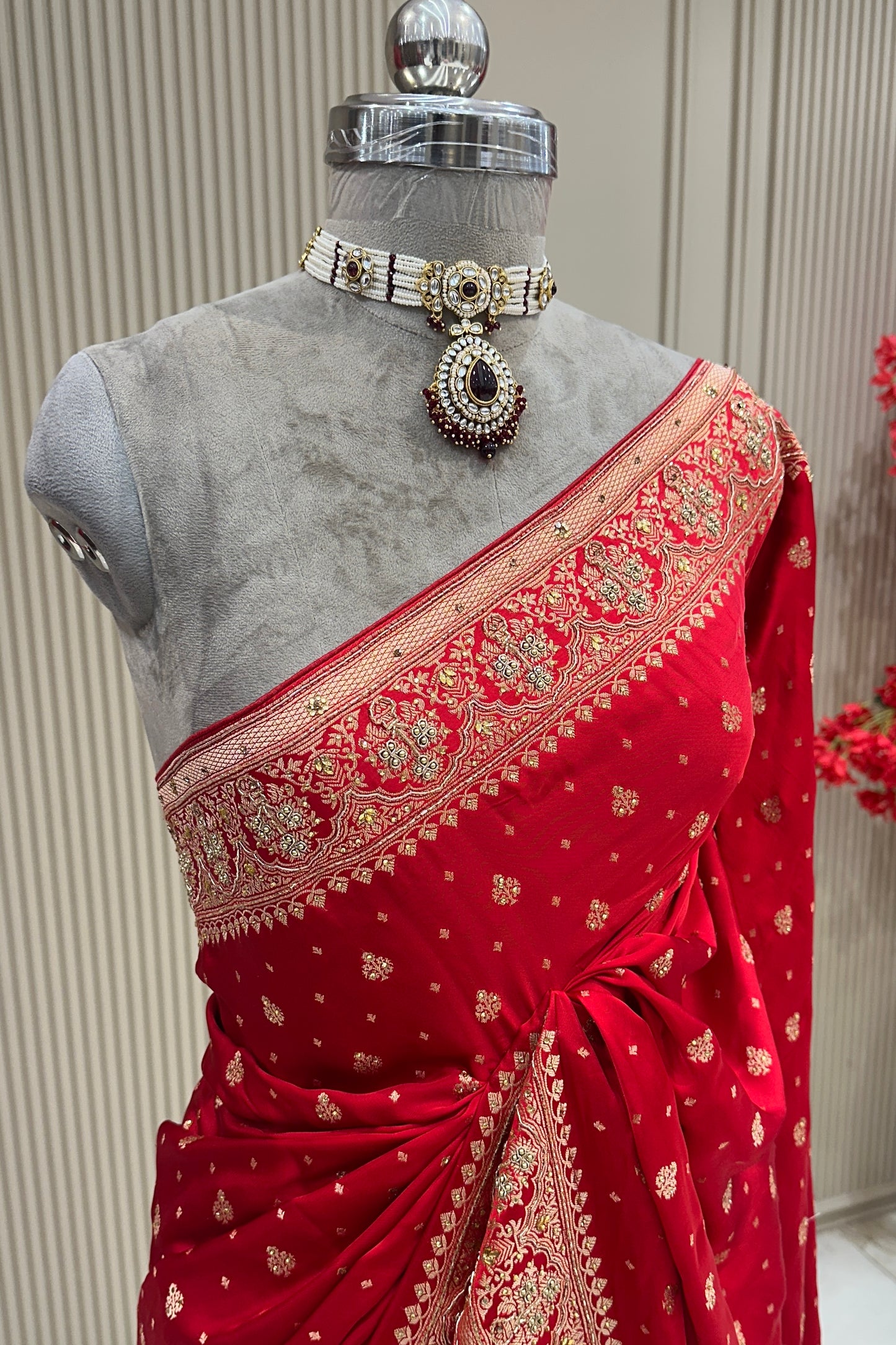 Close-up border view red satin silk saree with moti zardoshi cutdana, bridal & occasion saree from Urban Dulhaniya Pune