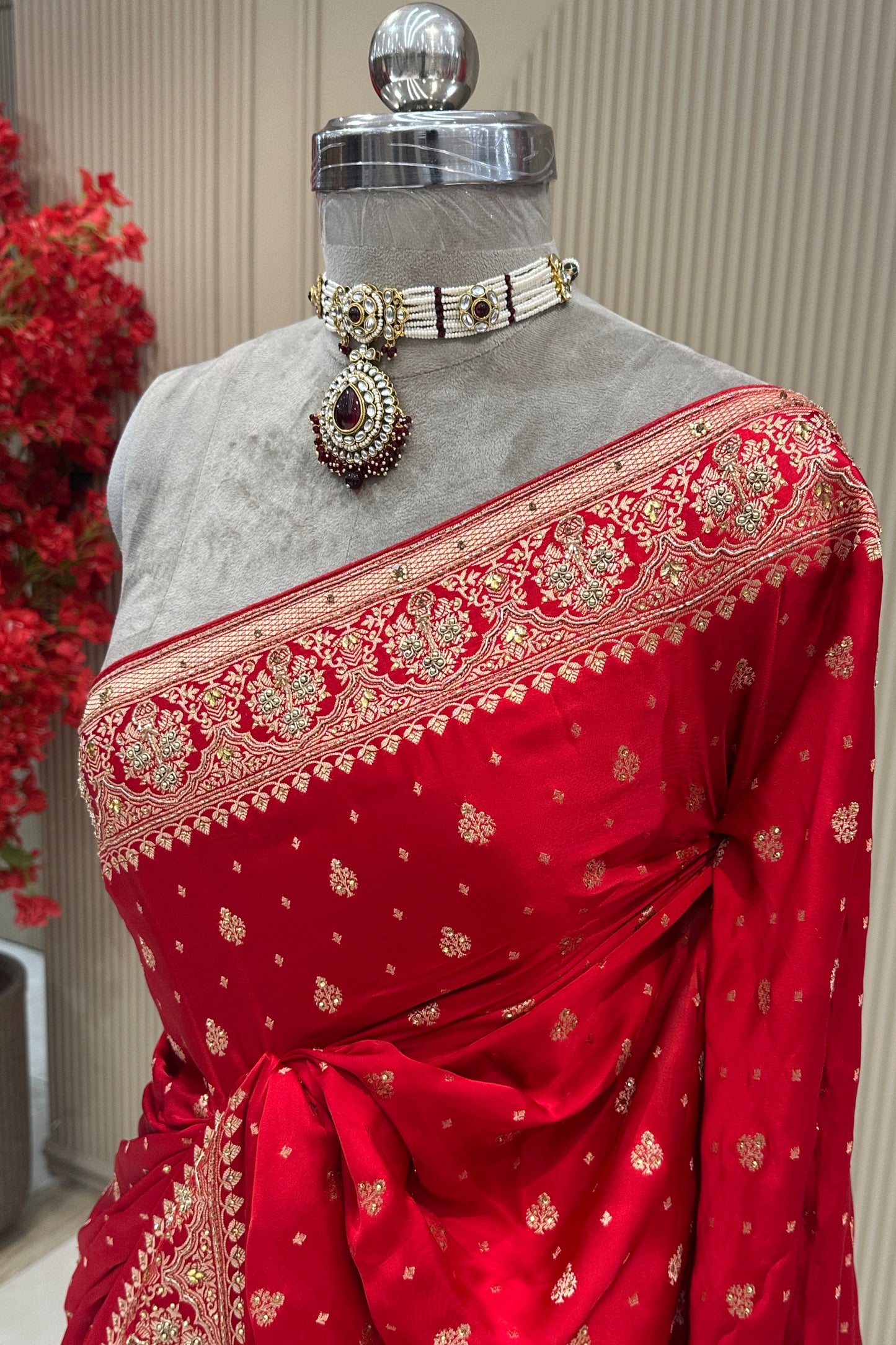 Drape detail view red satin silk saree with moti zardoshi cutdana work, designer bridal wear at Urban Dulhaniya Pune