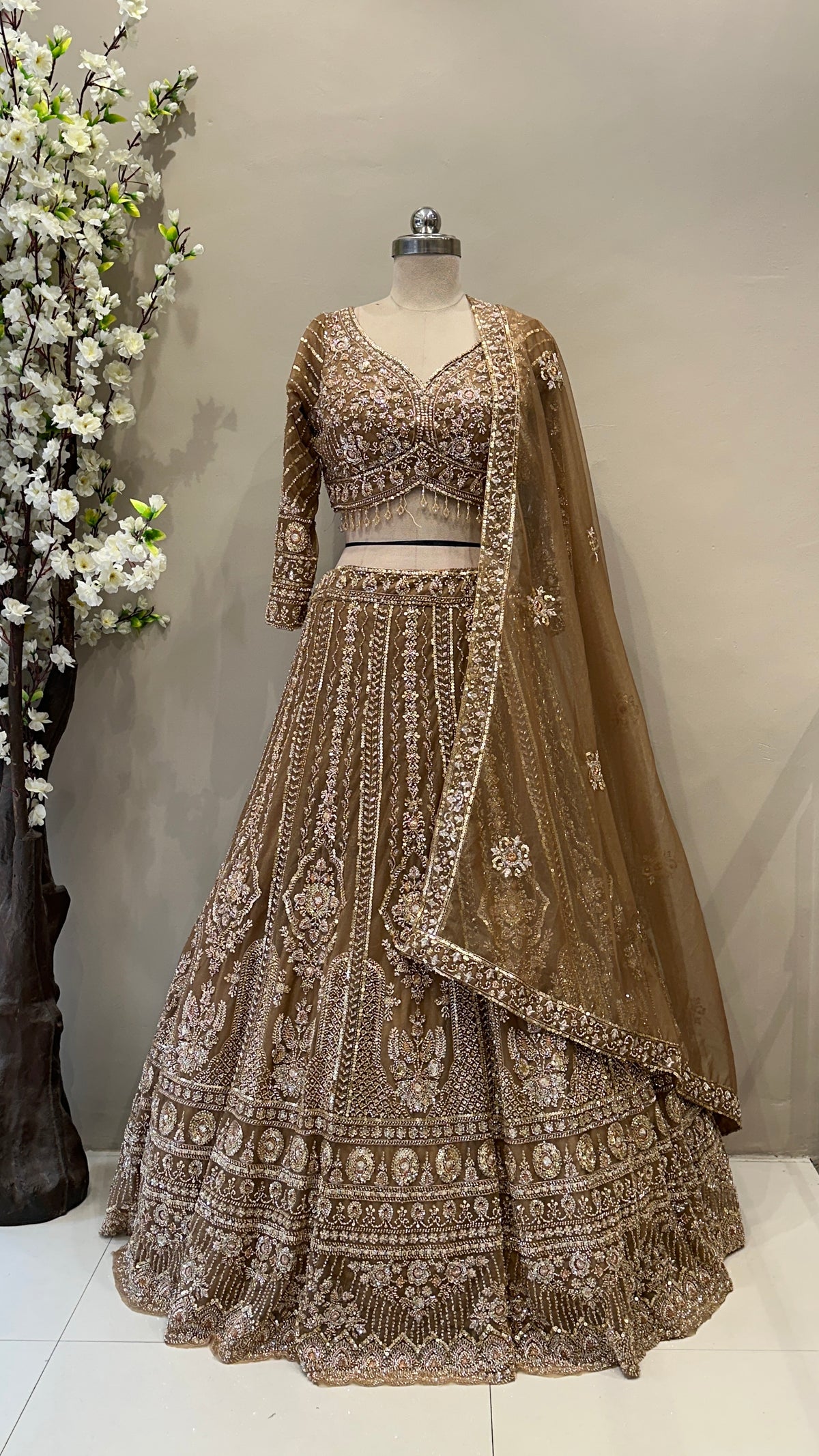 Front view bronze tissue organza lehenga skirt and matching embellished blouse premium ethnic wear from Urban Dulhaniya