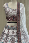 Close-up of floral print blouse, contrast waist panel, and lehenga waistband