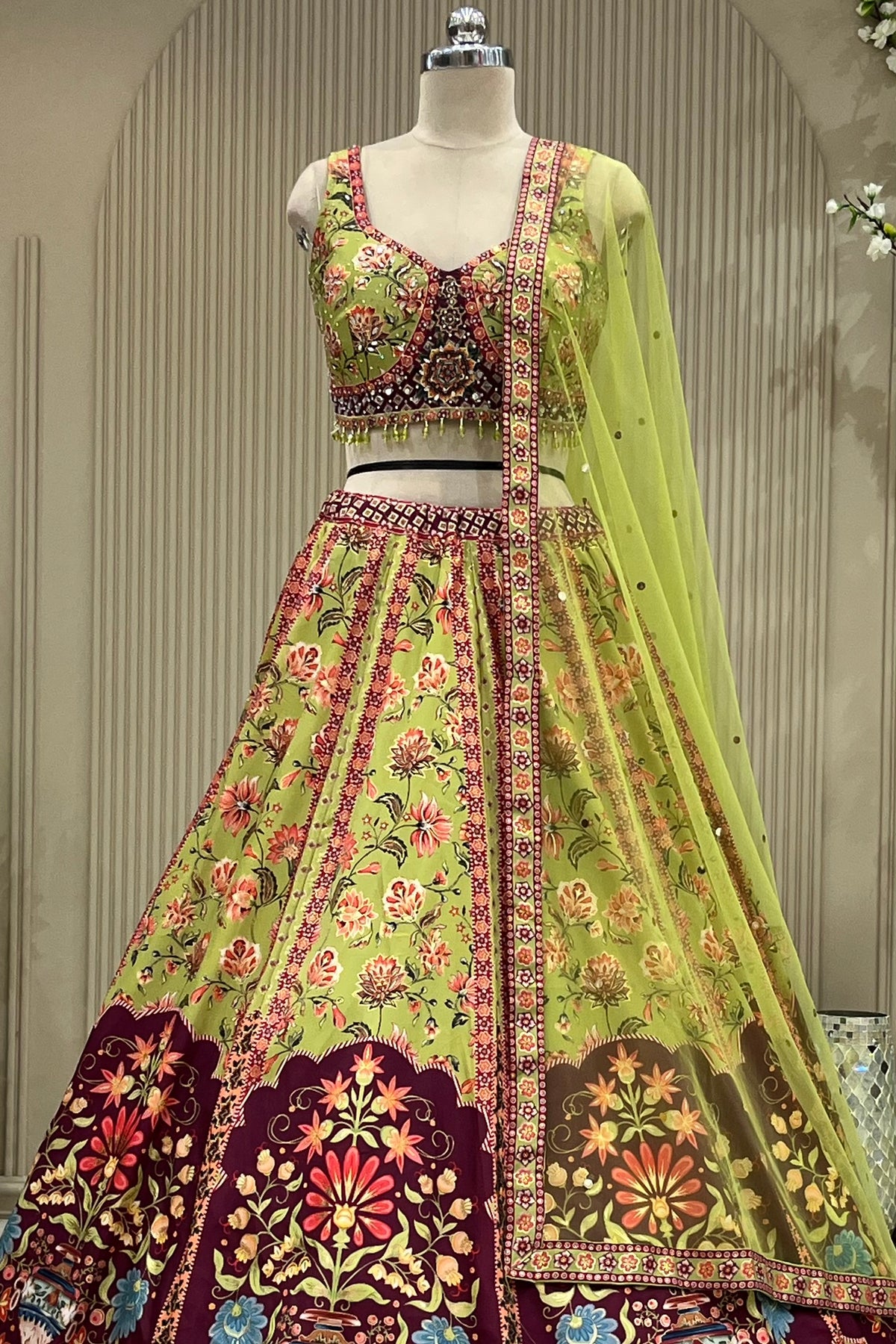 Close-up front view of mirror-work blouse and lehenga waistband with dupatta drape