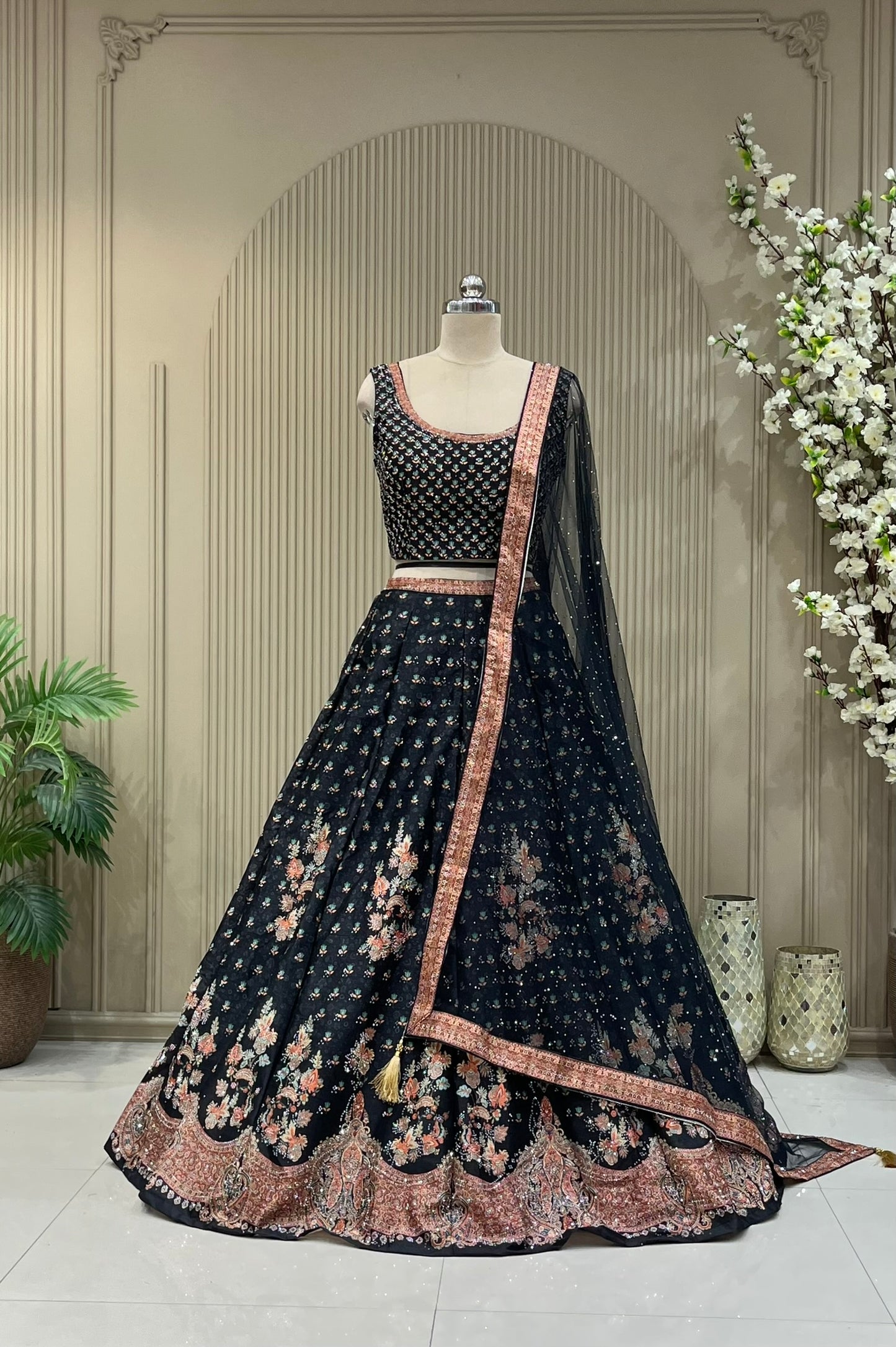 Black printed lehenga with sequin work, full front view on mannequin with net dupatta