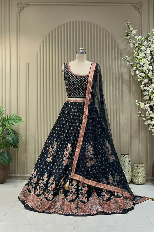 Black printed lehenga with sequin work, full front view on mannequin with net dupatta