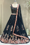 Front view of black printed blouse and lehenga with sequin net dupatta drape