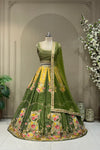 Olive green and mustard panelled printed lehenga, full front view on mannequin with sequin net dupatta