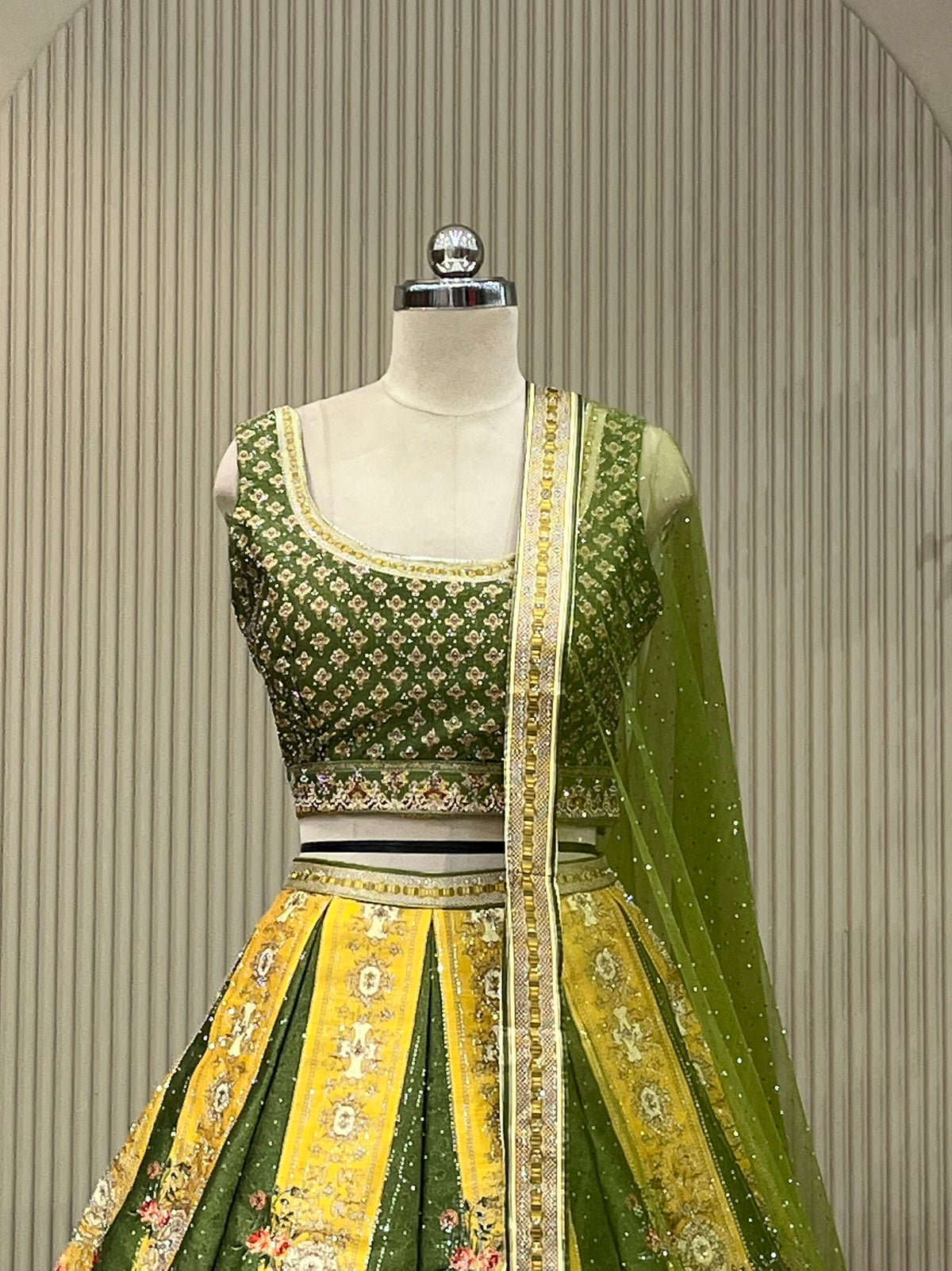 Panelled lehenga set showing floral border and mustard accent panels