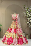 Pastel scallop printed lehenga, full front view on mannequin with sheer net dupatta