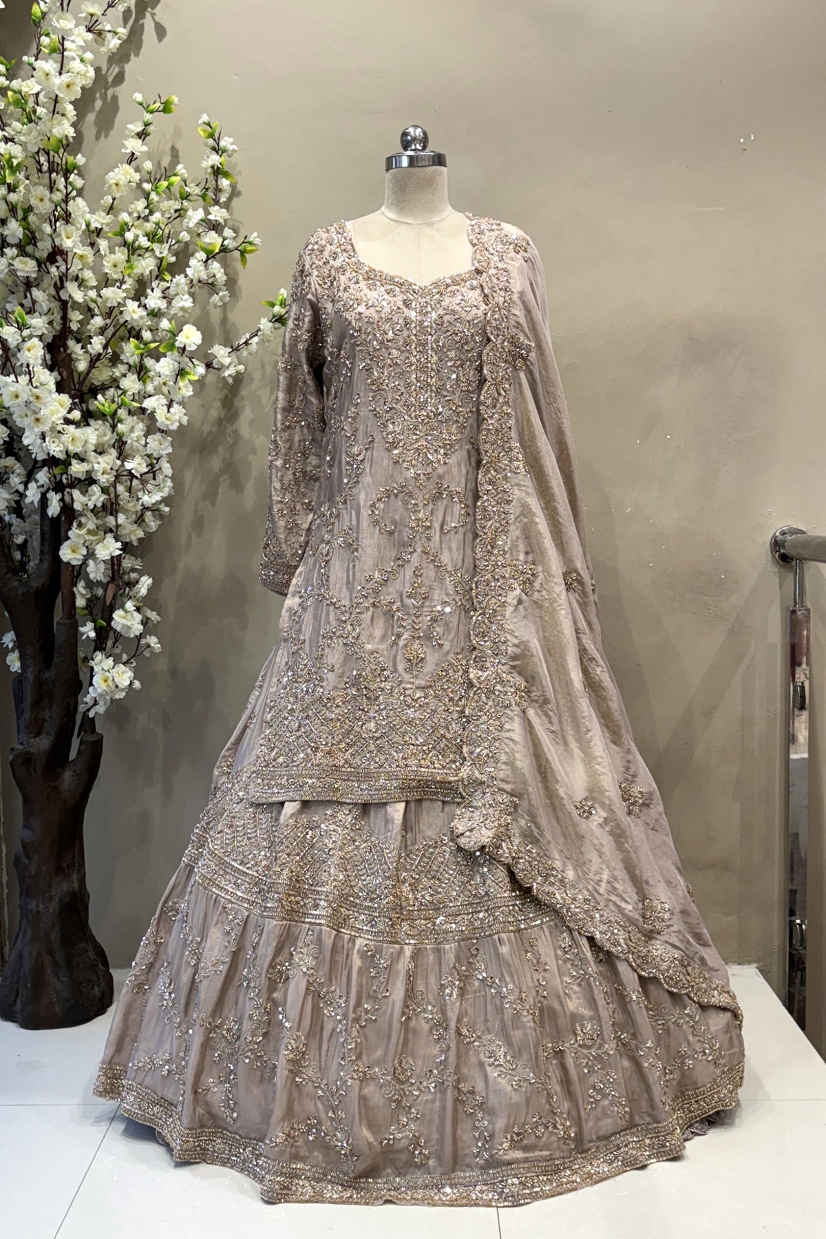 Flared designer lehenga skirt with vertical embroidery for a tall, regal bridal silhouette.