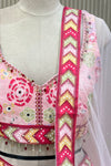 Close-up of mirror-work blouse, beaded tassel trim, and dupatta border