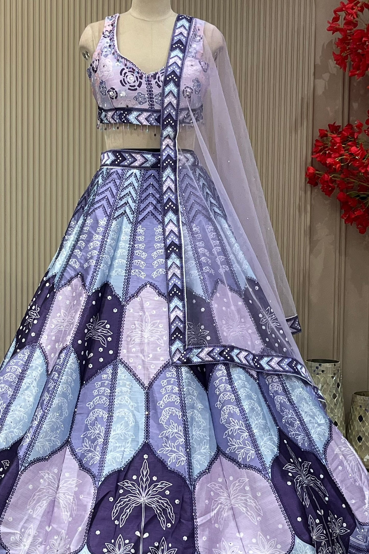 Lavender lehenga set showing scallop print skirt and chevron border trim