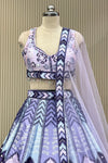 Front view of mirror-work blouse and lavender skirt with sheer dupatta drape