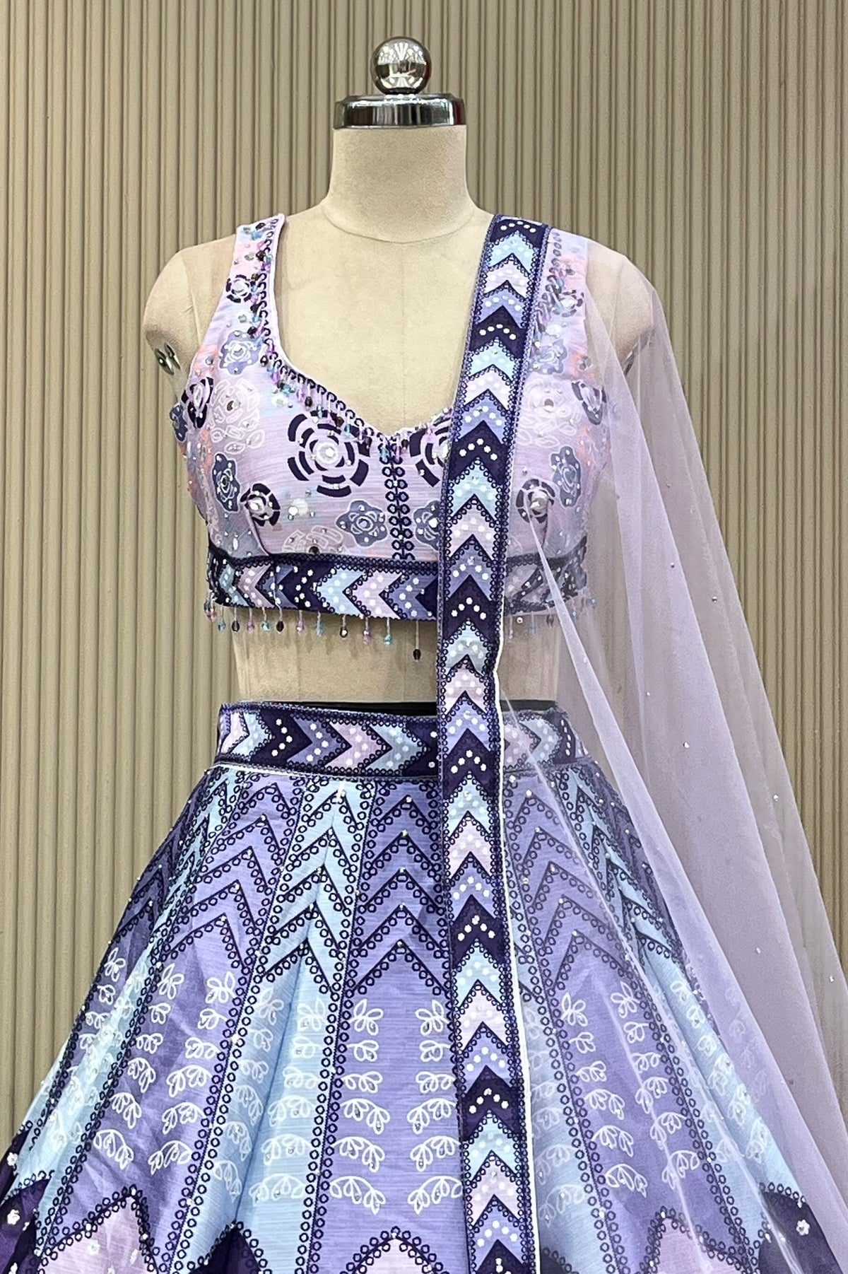 Front view of mirror-work blouse and lavender skirt with sheer dupatta drape