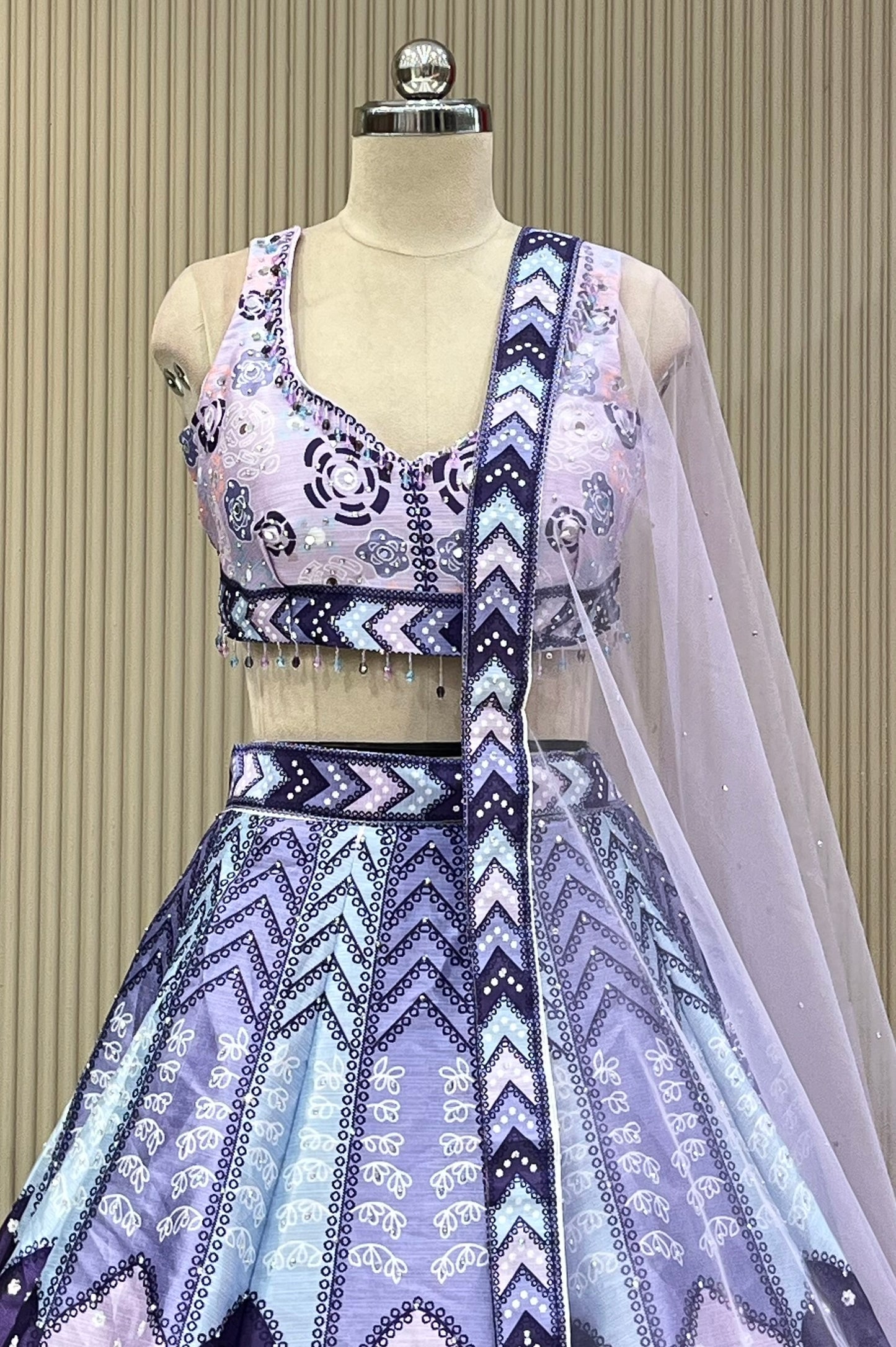 Front view of mirror-work blouse and lavender skirt with sheer dupatta drape