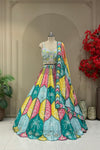Multicolor lehenga set showing teal, mustard, and pink scallop skirt panels