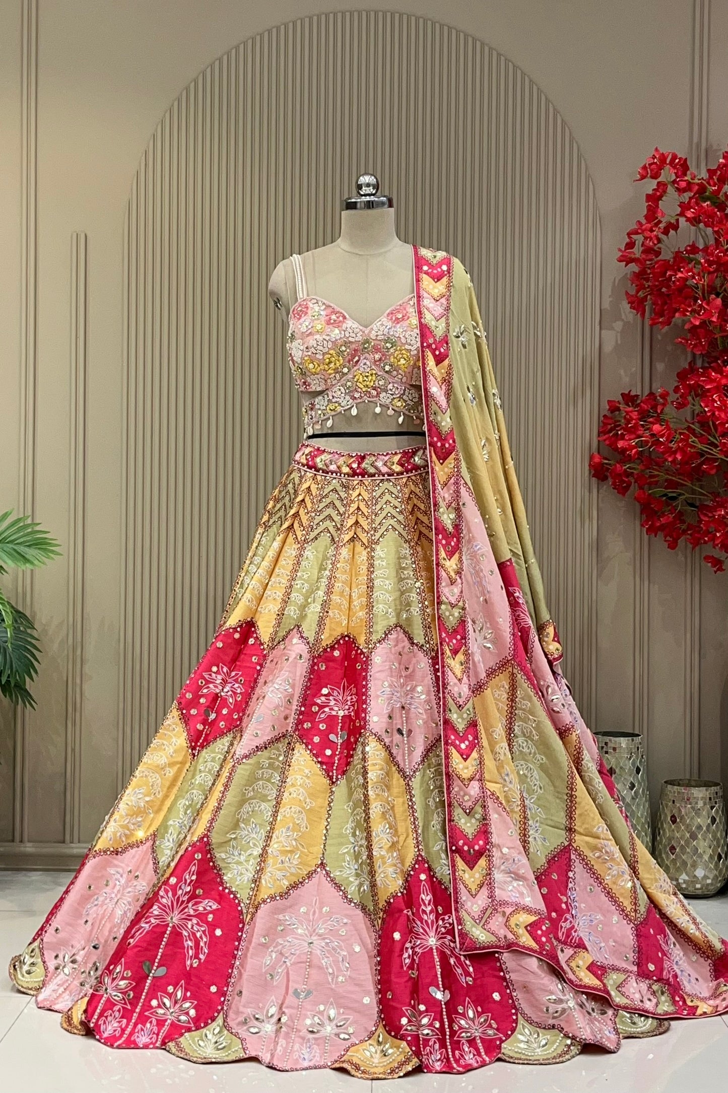 Pink-sage lehenga set showing scallop skirt panels and mirrored chevron dupatta border