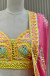 Close-up of hand-work blouse embroidery detail and pink dupatta embellishment