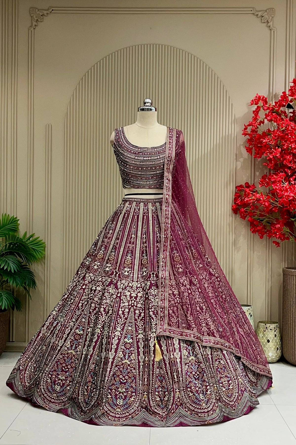 Wine printed lehenga with floral panel design, full front view on mannequin with net dupatta