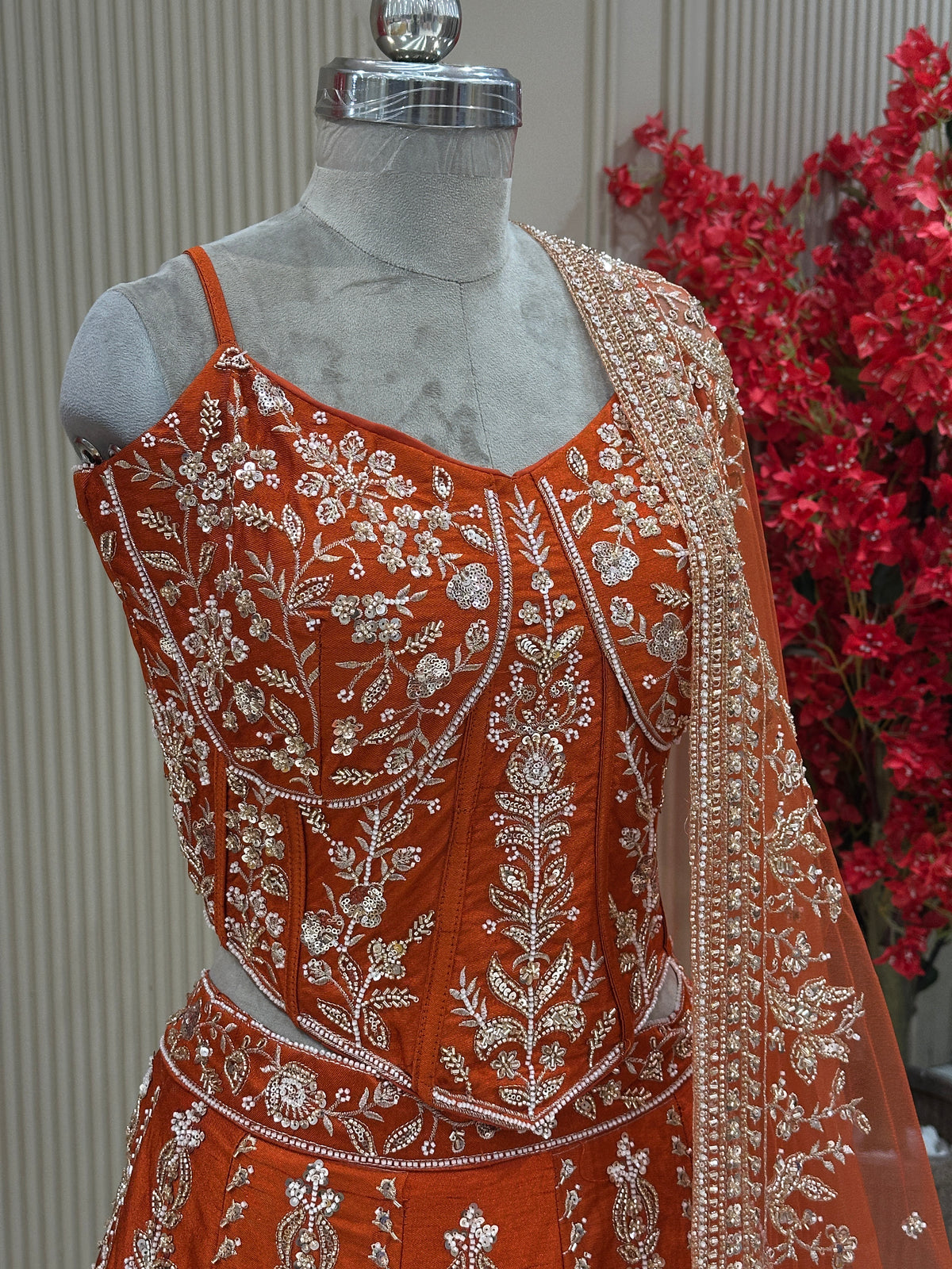 Angle close-up view rust raw silk bustier top with moti work bridal & occasion saree from Urban Dulhaniya Pune