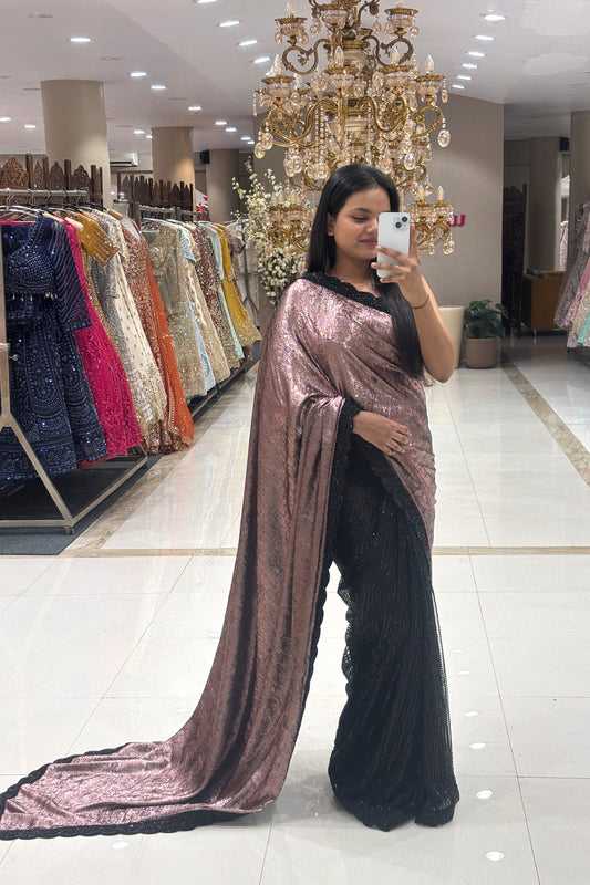 Full length mirror selfie of a woman wearing a luxury designer dual-tone metallic rose gold and black sequin cocktail saree at Urban Dulhaniya boutique in Pune