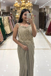 Close-up of a designer silver corset gown featuring pure handwork crystal embroidery, vertical bodice lines, and a ruched shimmer skirt for reception and cocktail parties.