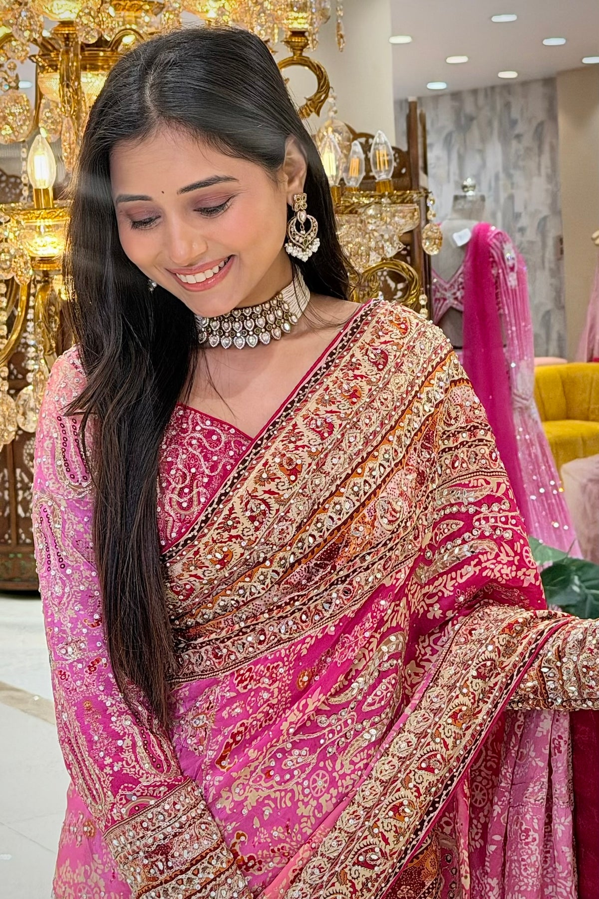 Close-up of pink printed chinon saree with handwork border details, premium ethnic wear from Urban Dulhaniya