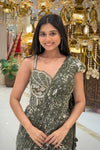 Close-up of handwork sweetheart blouse on olive green sequin saree, designer bridal wear from Urban Dulhaniya Pune