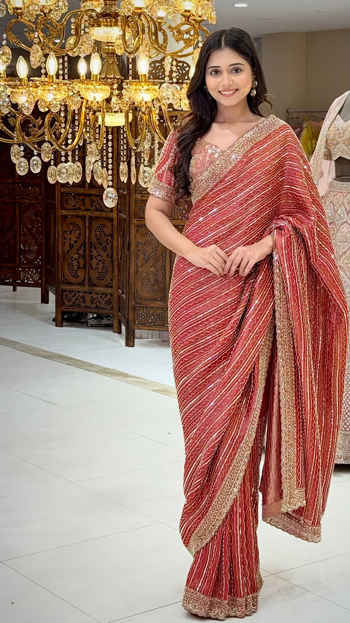 Full front view of red tissue saree with beads and sequin work, designer bridal wear at Urban Dulhaniya Pune