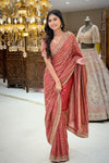 Drape detail of red tissue saree with cutdana embroidery, premium ethnic wear from Urban Dulhaniya