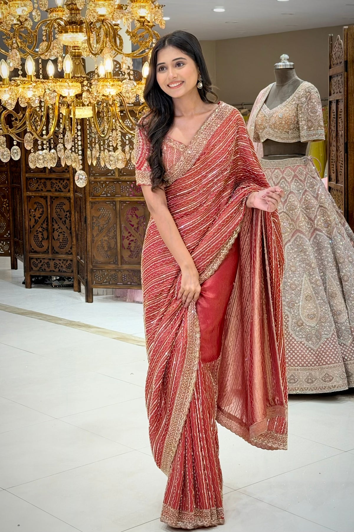Drape detail of red tissue saree with cutdana embroidery, premium ethnic wear from Urban Dulhaniya