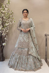 Designer sage green long kurta lehenga set with flared skirt and scalloped dupatta for brides.