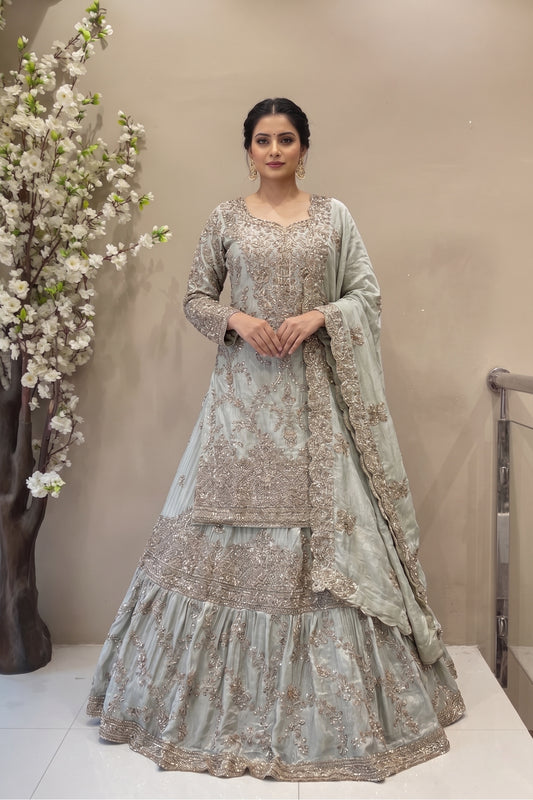 Designer sage green long kurta lehenga set with flared skirt and scalloped dupatta for brides.