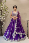Luxury royal purple silk lehenga with vertical embroidery and scalloped border for bridal sangeet or reception.