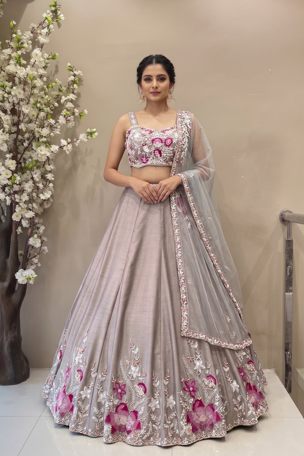 Designer mauve silk lehenga with pink floral handwork and flared silhouette for bridal or sangeet wear.