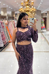 Full-body shot showcasing the figure-hugging mermaid silhouette and intricate floral beadwork of a premium aubergine purple reception lehenga on MG Road, Pune.