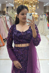 Close-up of a designer deep purple sequin long-sleeve lehenga blouse with beaded tassels and a sheer dupatta at the Urban Dulhaniya boutique.