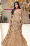 Champagne gold mermaid lehenga set with net dupatta and flared hem – reception wear Urban Dulhaniya