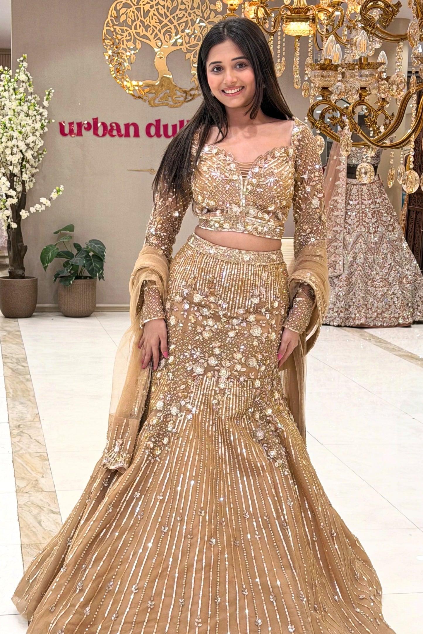Champagne gold mermaid lehenga set with net dupatta and flared hem – reception wear Urban Dulhaniya
