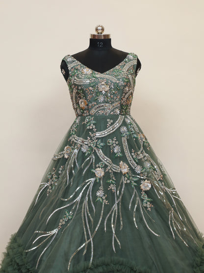 Reception Wear Ball Gown with Bottom Ruffle pattern and handwork embellishments which gives it a grand look
