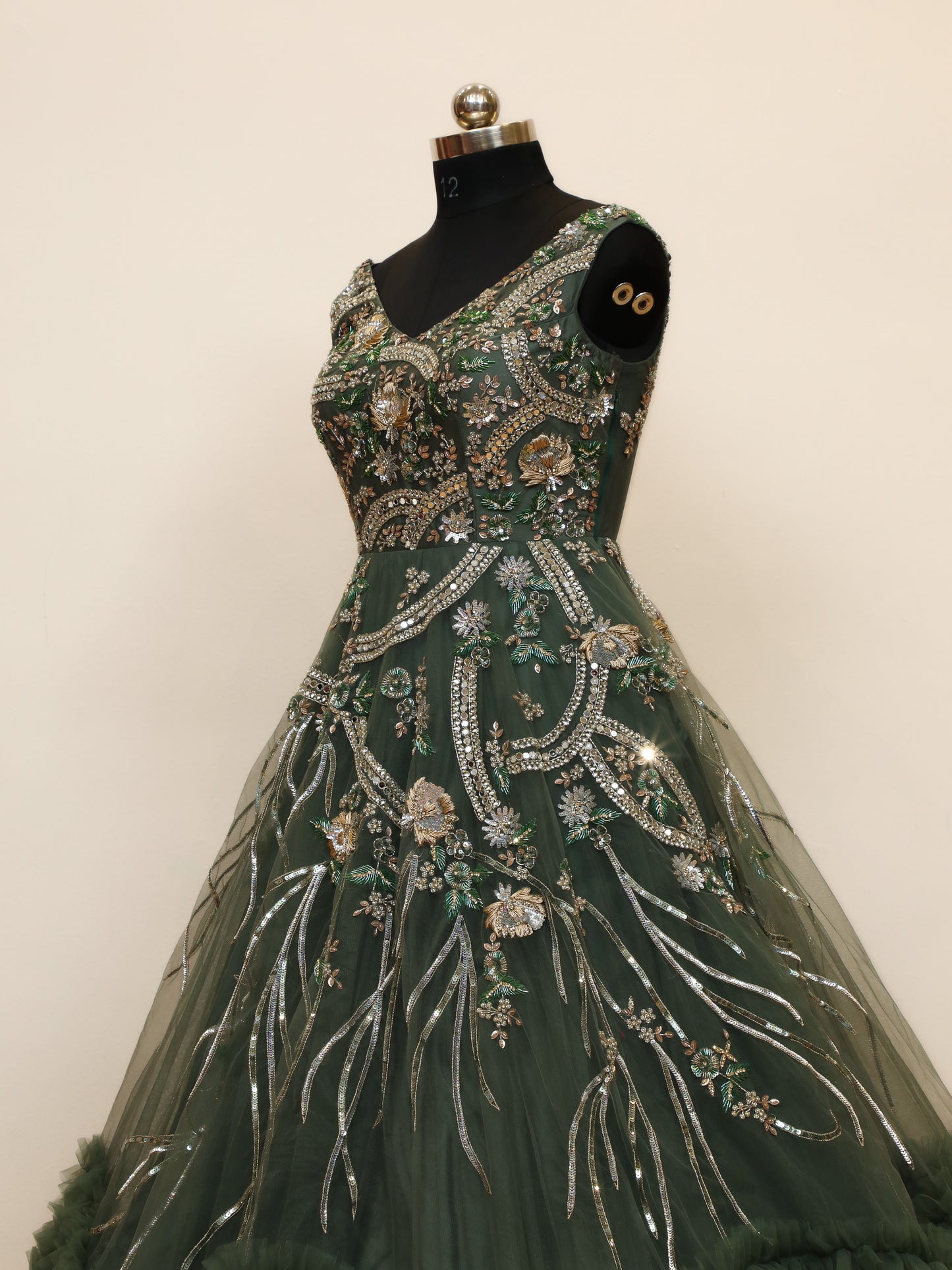 Reception Wear Ball Gown with Bottom Ruffle pattern and handwork embellishments which gives it a grand look